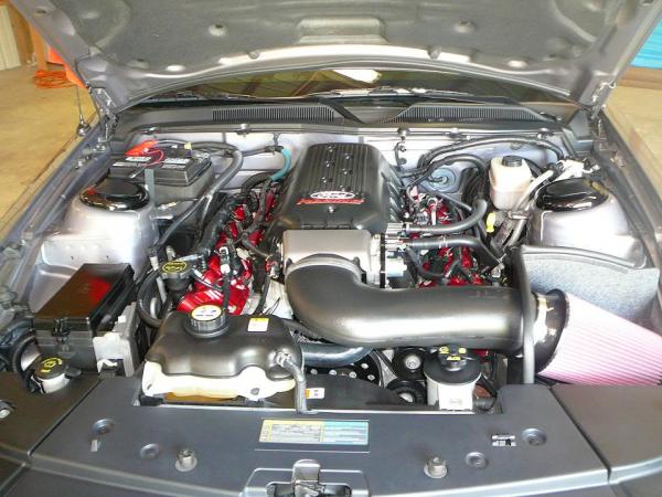 07 engine bay. Frpp intake, hotrod cams, Kooks LT headers, O/R H pipe, JLT 110mm CAI, radiator side covers, shock tower covers, painted valve covers